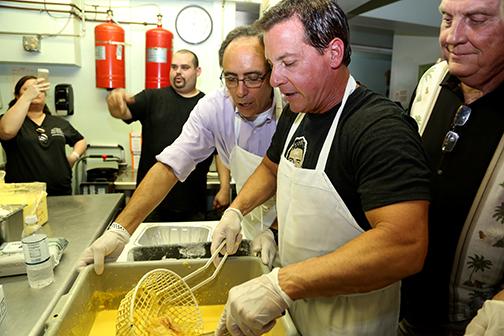 Al Copeland, Jr. frying chicken